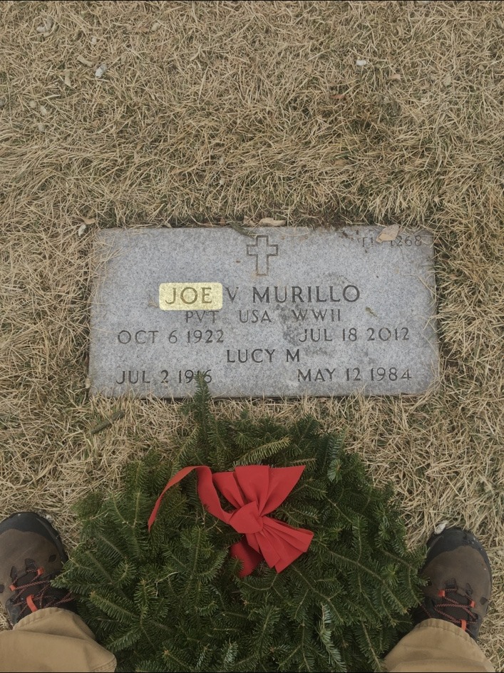 Joe V. Murillo’s World War II Army grave marker at Fort Logan National Cemetery, decorated with a Christmas wreath